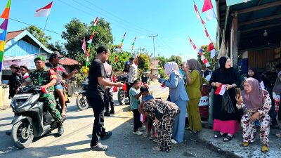 Menyemarakkan HUT ke-81 RI, Polres Halmahera Timur Membagikan Bendera Merah Putih kepada Masyarakat